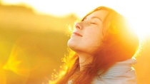 Close up side portrait of a woman with closed eyes in the sun Close up side portrait of a woman with closed eyes in the sun