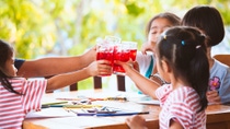 Children with red beverages