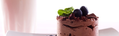 Chocolate Moose dessert on a white plate with milk