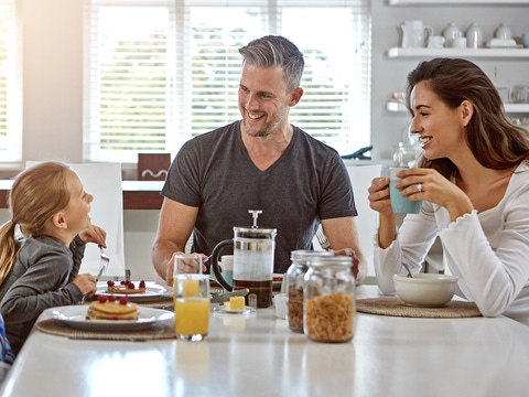 Happy family eating at a table
