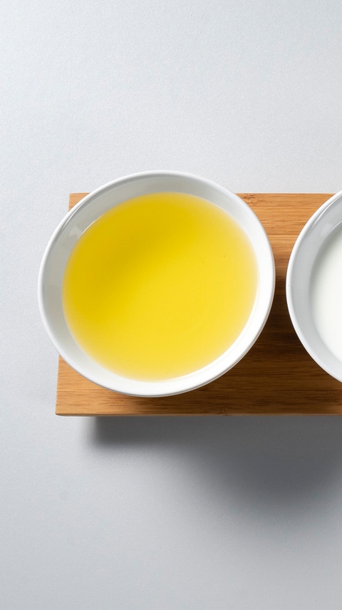Bowls with oil, milk, flour, rice, sugar and stock cubes