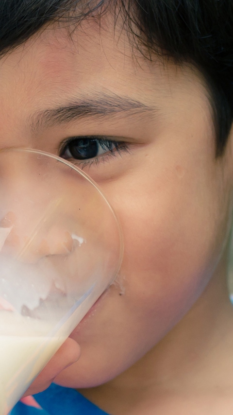 Child drinking a glass of milk Child drinking a glass of milk